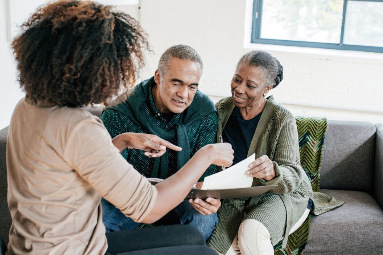 advisor speaking to senior couple