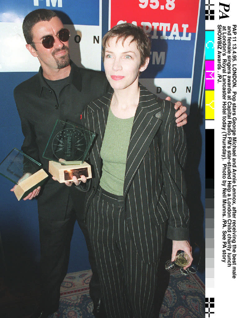 Pop stars George Michael and Annie Lennox, after receiving the best male and female singers awards at Capital Radio FM's star-studded Help A London Child charity lunch  at London's Royal Lancaster Hotel.