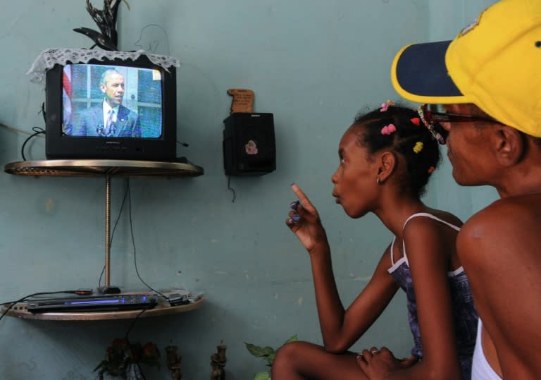 Cubans watch US President Barack Obama's speech about the reestablishment of full diplomatic ties with Cuba, in Havana on July 1, 2015