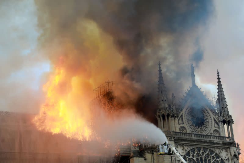 Firefighters tackle the blaze at the Notre Dame Cathedral. Source: Getty