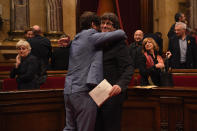 <p>Catalan President Carles Puigdemont (R) is hugged by Minister of Health Antoni ComÃ­n as they react to the news that the Catalan Parliament has voted in favour of independence from Spain at the Catalan Government building Generalitat de Catalunya on Oct. 27, 2017 in Barcelona, Spain. (Photo: David Ramos/Getty Images) </p>