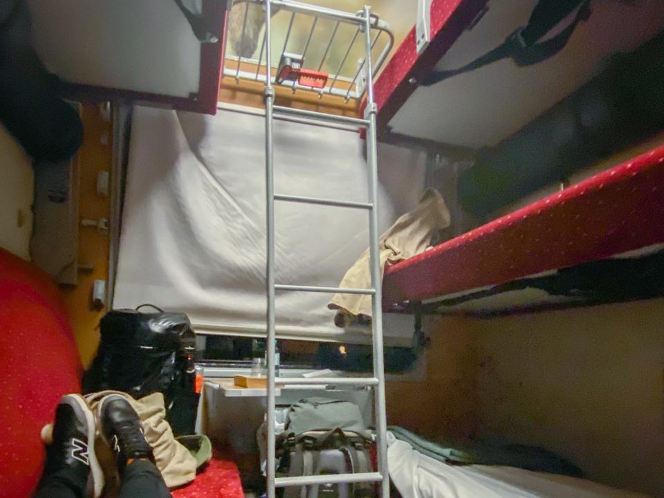 The author lays in her bunk in the shared cabin.