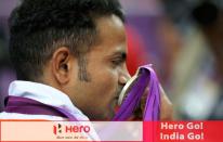 India's silver medal winner Vijay Kumar kisses his silver medal won in the men's 25m rapid fire pistol shooting event at the London 2012 Olympic Games at the Royal Artillery Barracks August 3, 2012. REUTERS/Sergio Moraes