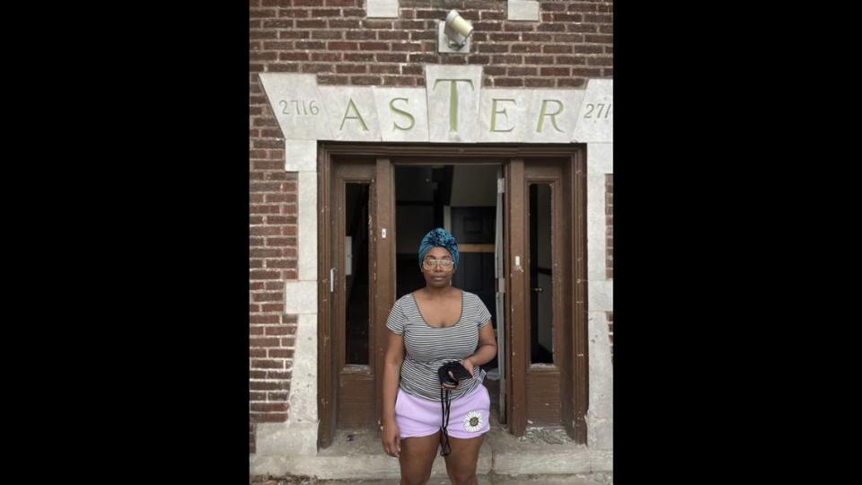 Shampelle Davis stands in front of the Aster building, the Kansas City apartment building where she lived which burned down on April 11, displacing the tenants.