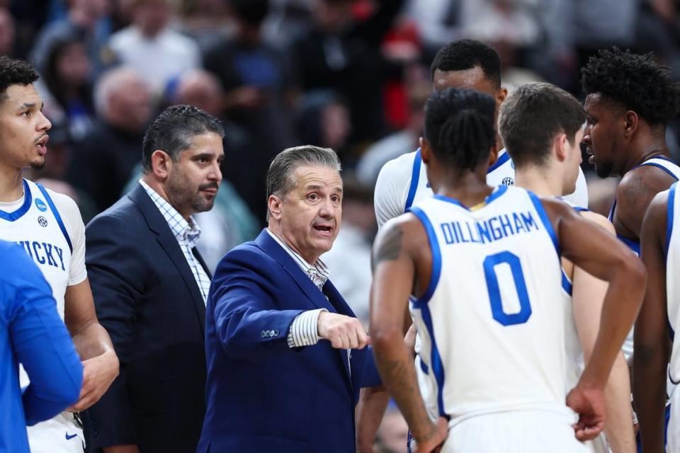 Kentucky head coach John Calipari talks with his team during a timeout in Thursday night’s game. The Wildcats were knocked out of the NCAA Tournament for the second time in three years by a team seeded in the teens.