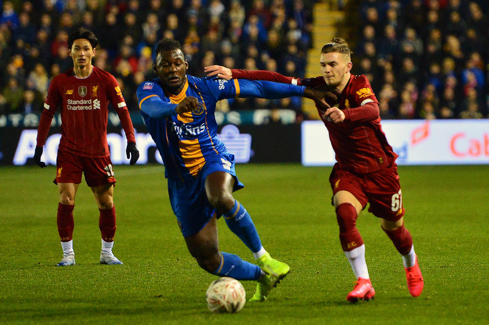 SHREWSBURY, ENGLAND - JANUARY 26: Shrewsbury Town's Aaron Pierre vies for possession with Harvey Elliott of Liverpool during the FA Cup Fourth Round match between Shrewsbury Town and Liverpool at New Meadow on January 26, 2020 in Shrewsbury, England. (Photo by Richard Martin-Roberts - CameraSport via Getty Images)