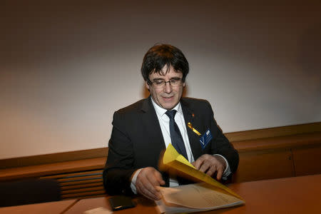 Former Catalan leader Carles Puigdemont takes a seat before his briefing on the situation in Catalonia at Finnish Parliament in Helsinki, Finland March 22, 2018. Lehtikuva/Martti Kainulainen via REUTERS
