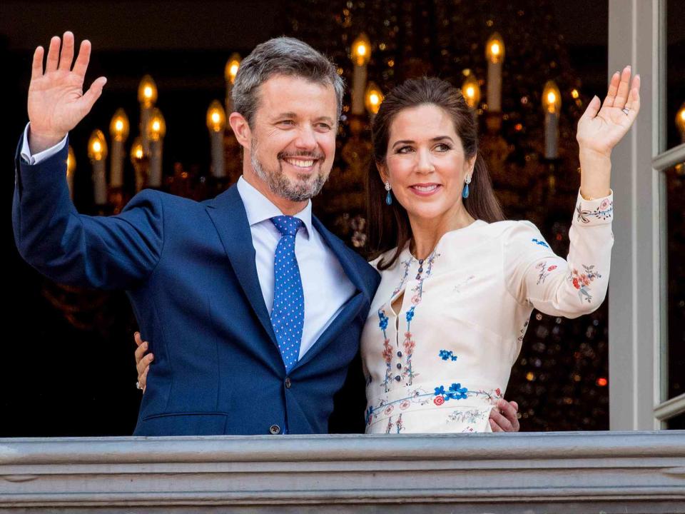 <p>Patrick van Katwijk/Getty</p> Crown Prince Frederik of Denmark and Crown Princess Mary of Denmark appear on the balcony as the Royal Life Guards carry out the changing of the guard on Amalienborg Palace square on May 26, 2018 in Copenhagen, Denmark.