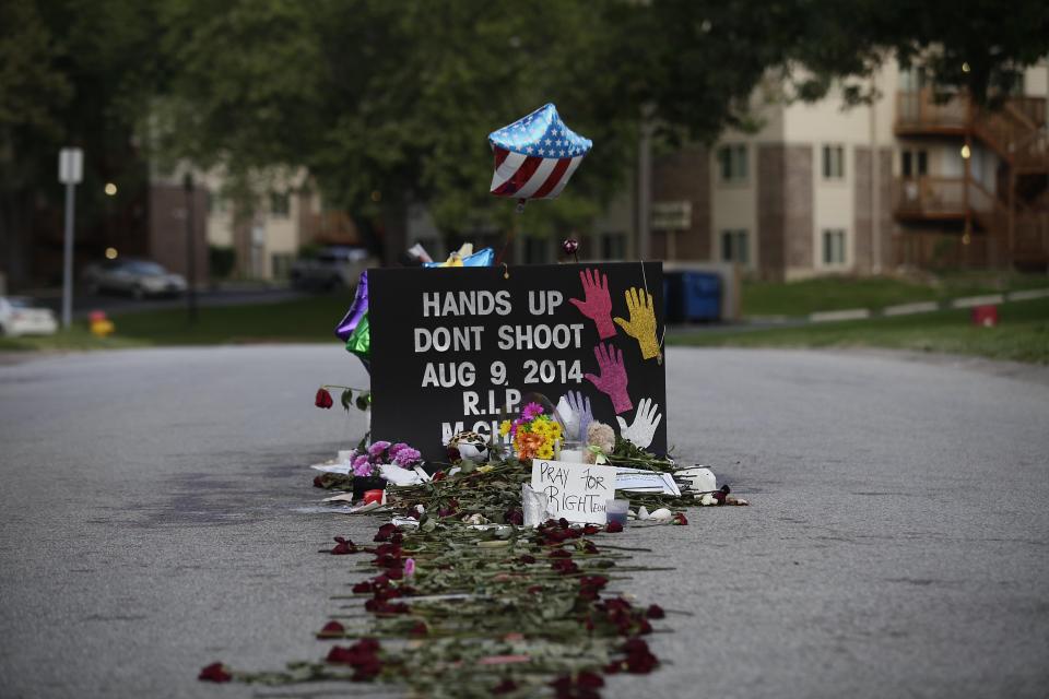 A makeshift memorial in Ferguson, Mo., for Michael Brown, who was fatally shot by Police Officer Darren Wilson on Aug. 9, 2014. (Photo: Joshua Lott/AFP/Getty Images)