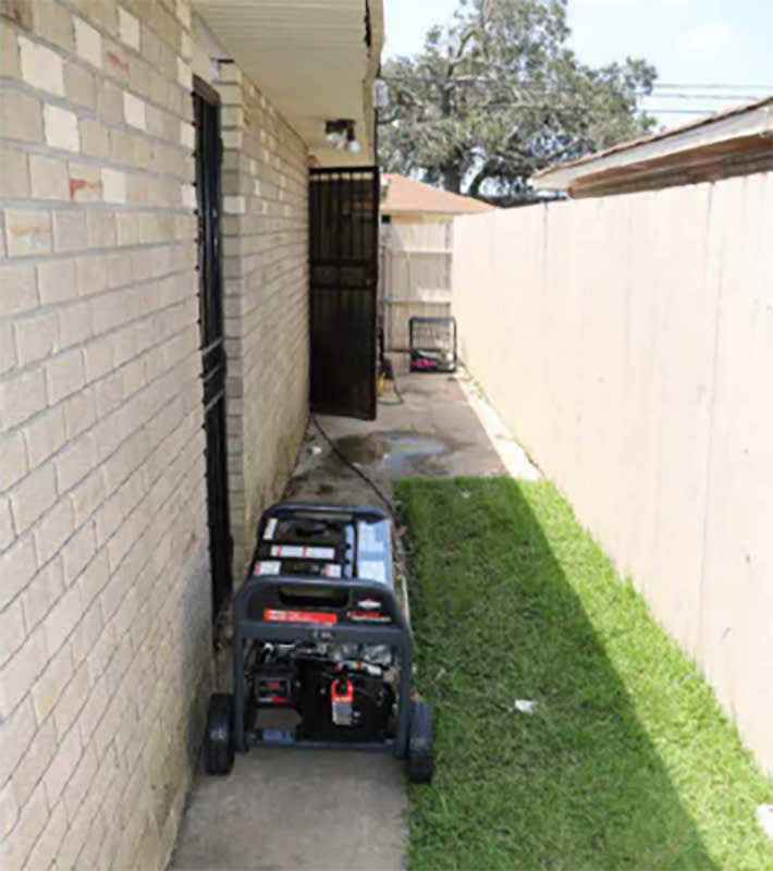 Image: Curley family's side yard with the portable generator. (Jefferson Parish Sheriff's Office)