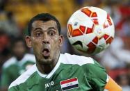 Iraq's Younus Mahmood eyes the ball during their Asian Cup Group D soccer match against Jordan at the Brisbane Stadium in Brisbane January 12, 2015. REUTERS/Edgar Su (