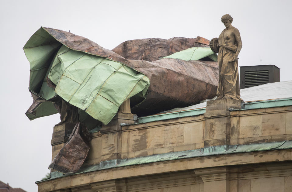 The roof of the opera house is damaged after a storm in Stuttgart, Germany, Tuesday, June 29, 2021. Thunderstorms hit Germany late Monday and torrential rains poured down on the southern and western parts of the country leading to dozens of accidents and hundreds of firefighter operations throughout the night. (Christoph Schmidt/dpa via AP)