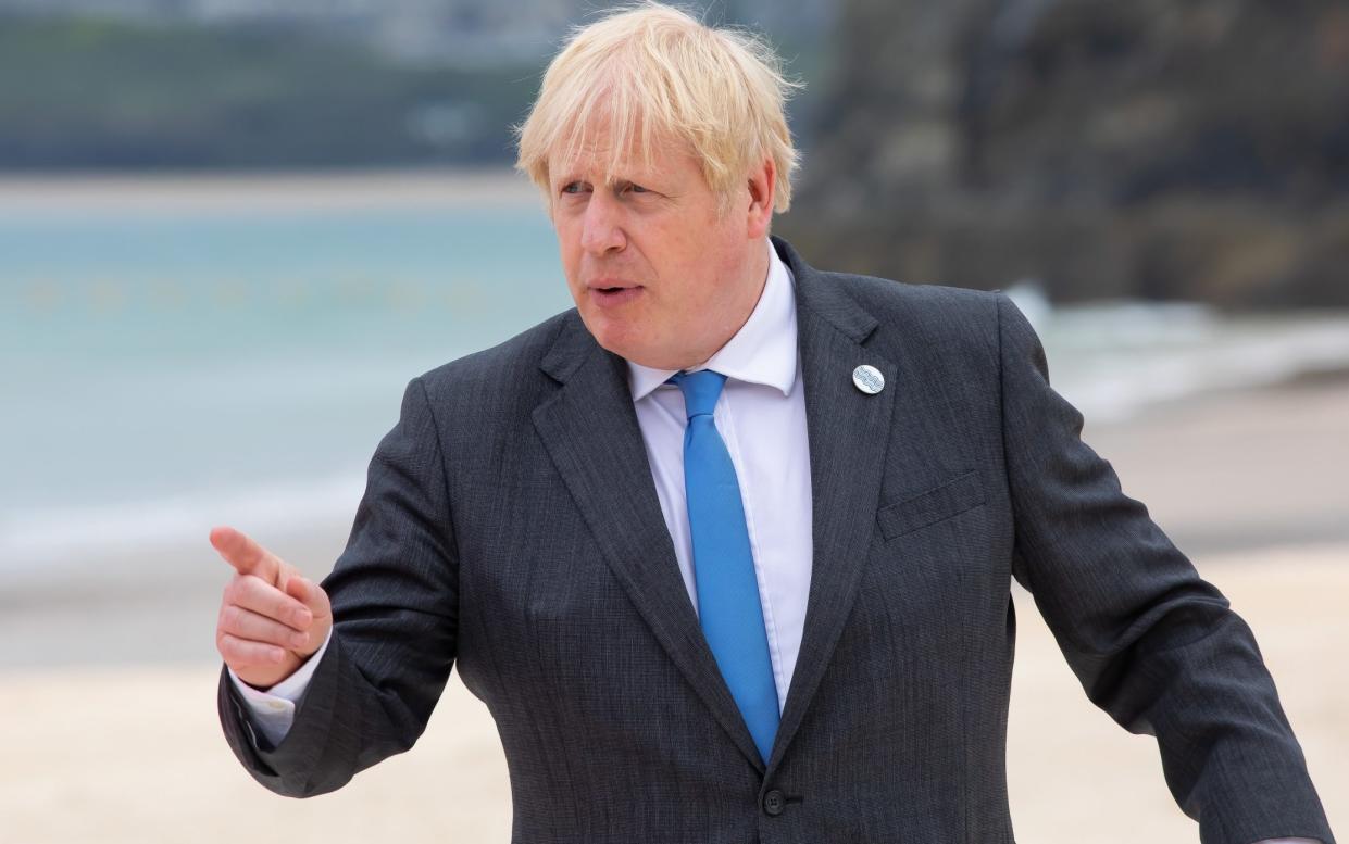 Boris Johnson has been forced to postpone plans after a rise in cases - GETTY IMAGES