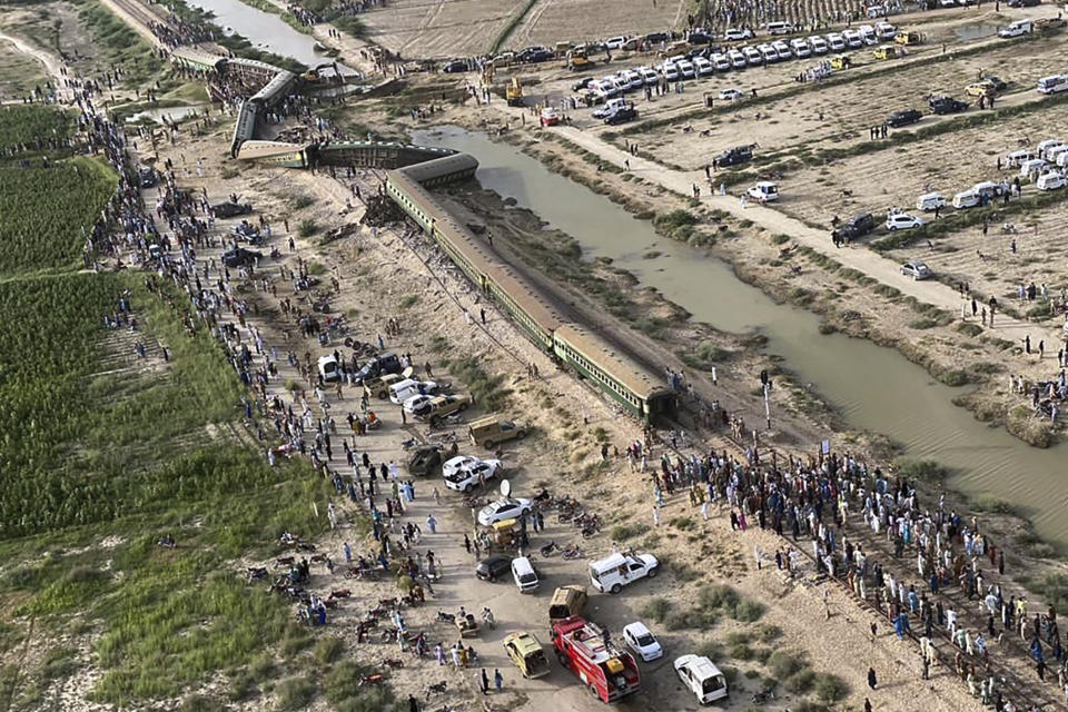 In this photo released by Chief Minister office of Pakistani Sindh province, shows an arial view of the site of a passenger train derailed near Nawabshah, Pakistan, Sunday, Aug. 6, 2023. Railway officials say some passengers were killed and dozens more injured when a train derailed near the town of Nawabshah in southern Sindh province. (Sindh Chief Minister office via AP)