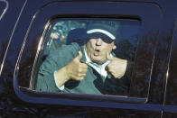 President Donald Trump gives two thumbs up to supporters as he departs after playing golf at the Trump National Golf Club in Sterling Va., Sunday Nov. 8, 2020. (AP Photo/Steve Helber)