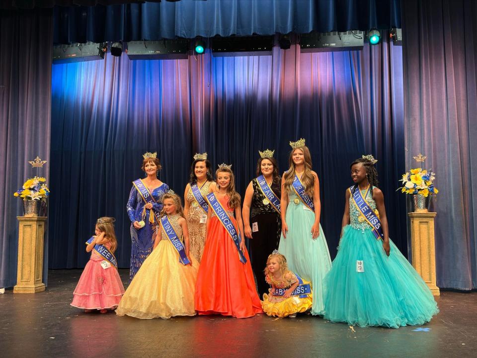 The 2023 Karns Fairest of the Fair Court shines with smiles all around (mostly) at the Karns Fairest of the Fair Pageant, Karns High School on July 8, 2023. From left: Wee Miss Raelynn Webb, Ms. Karns Natalie Soule, Tiny Miss Brinkley Milligan, Fairest of the Fair Madison Clabough, Princess Tybee Milligan, Fair Lady Lexie Austin, Baby Miss Everleigh Human, Jr. Fairest of the Fair Bailey McNew, and Little Miss Jada Vaughan.