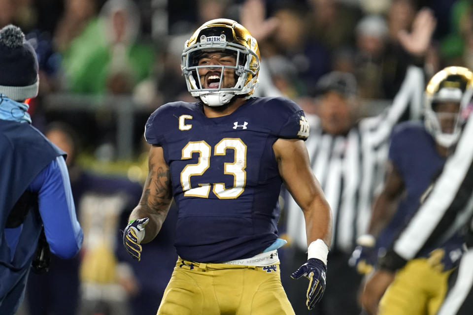 Notre Dame running back Kyren Williams (23) celebrates his five-yard touchdown run against Southern California in the first half of an NCAA college football game in South Bend, Ind., Saturday, Oct. 23, 2021. (AP Photo/Paul Sancya)