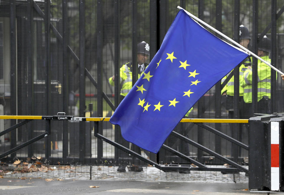 A European Union flag is flown in front of entrance gates to Parliament in London, Monday, Sept. 9, 2019. British Prime Minister Boris Johnson voiced optimism Monday that a new Brexit deal can be reached so Britain leaves the European Union by Oct. 31. (AP Photo/Kirsty Wigglesworth)