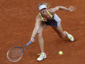 FILE- In this Thursday, June 6, 2019, image, Russia's Maria Sharapova returns the ball to Belarus' Victoria Azarenka during their semifinal match of the French Open tennis tournament at the Roland Garros stadium in Paris. The skill of sliding at Roland Garros is on hold at the moment with the start of the French Open postponed until September because of the coronavirus, and Sharapova once joked that the slippery clay made her look like "a cow on ice." but sliding is one of the keys to success at the French Open. (AP Photo/Christophe Ena, File)