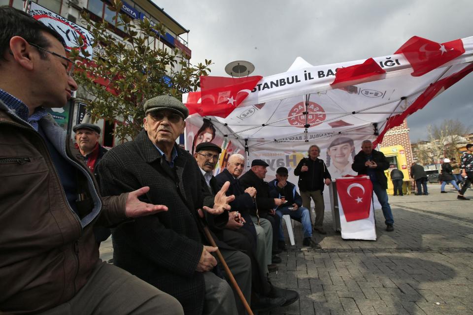 In this Wednesday, March 15, 2017 photo, supporters of Turkey's main opposition Republican People's Party, or CHP, sit at their tent promoting the 'NO' vote for the upcoming referendum, in central Istanbul. The entire Turkish referendum campaign has been biased and unfair, those opposed to expanding the president’s powers say, noting they have been hampered by a lack of TV airtime, threats, violence, arbitrary detentions and even sabotage. Those reports come even as Turkish President Recep Tayyip Erdogan himself has slammed European countries for not letting his ministers campaign on their soil for the April 16 vote on expanding his powers. (AP Photo/Lefteris Pitarakis)