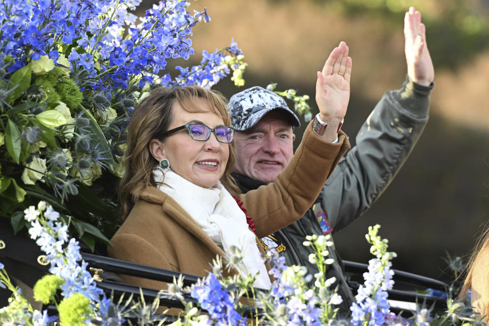 Tournament of Roses Grand Marshal Gabby Giffords waves to the crowd at the 134th Rose Parade in Pasadena, Calif., Monday, Jan. 2, 2023. (AP Photo/Michael Owen Baker)