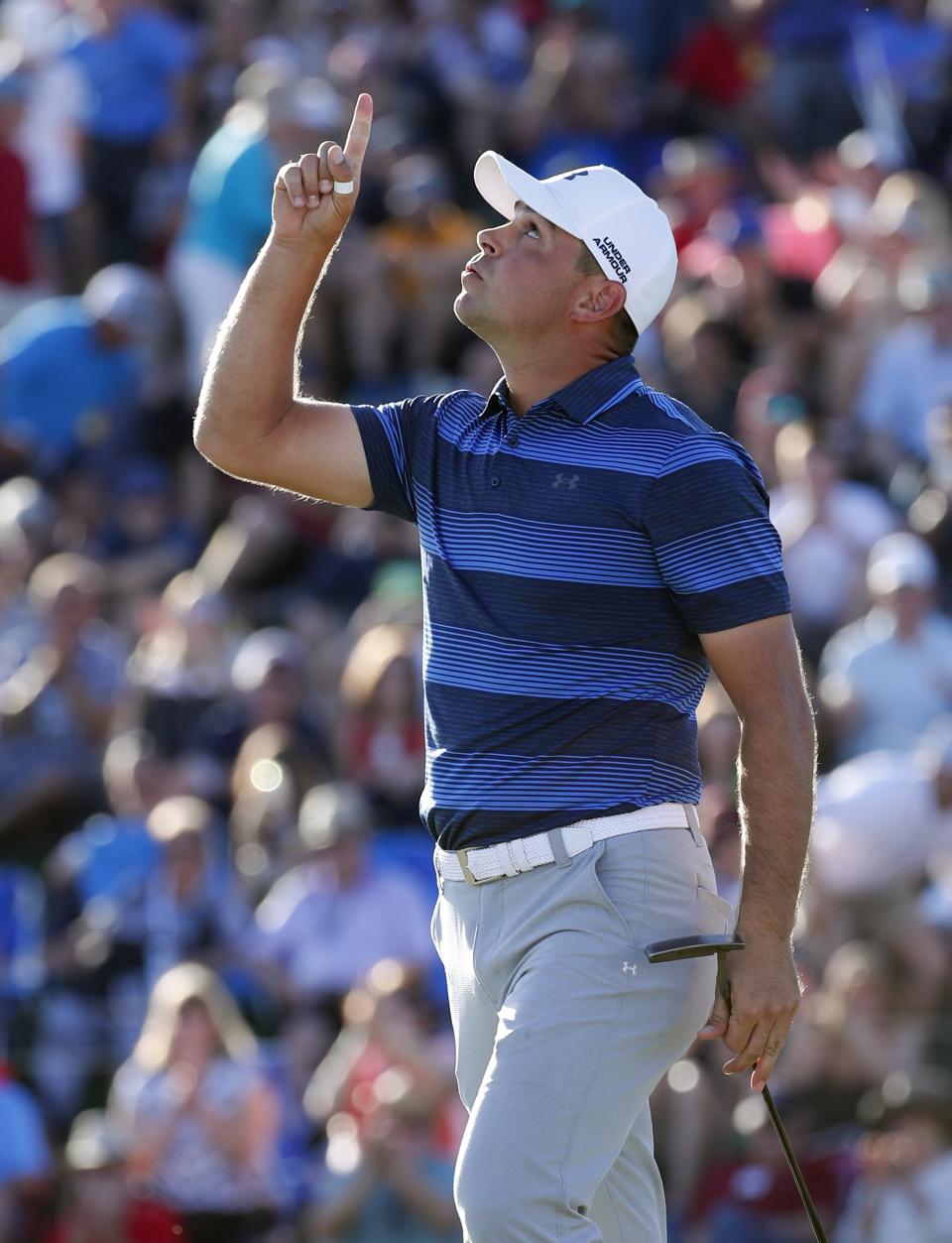 Gary Woodland points after winning the Waste Management Phoenix Open on the first playoff hole in Scottsdale, Ariz. February 4, 2018.