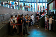 People wait in line to buy bus tickets at a bus station in Caracas, Venezuela May 21, 2018. Picture taken May 21, 2018. REUTERS/Marco Bello