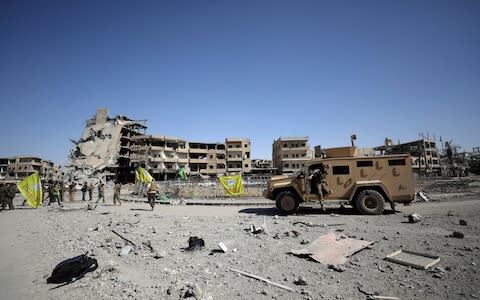 Fighters of Syrian Democratic Forces are seen in Raqqa, Syria October 17, 2017 - Credit: REUTERS