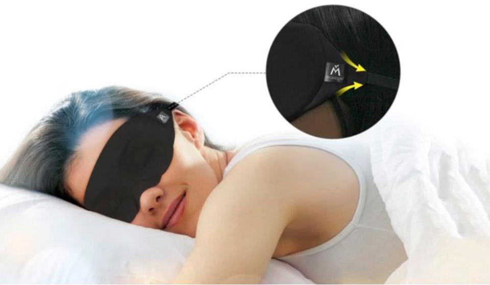 woman sleeping wearing a sleep mask