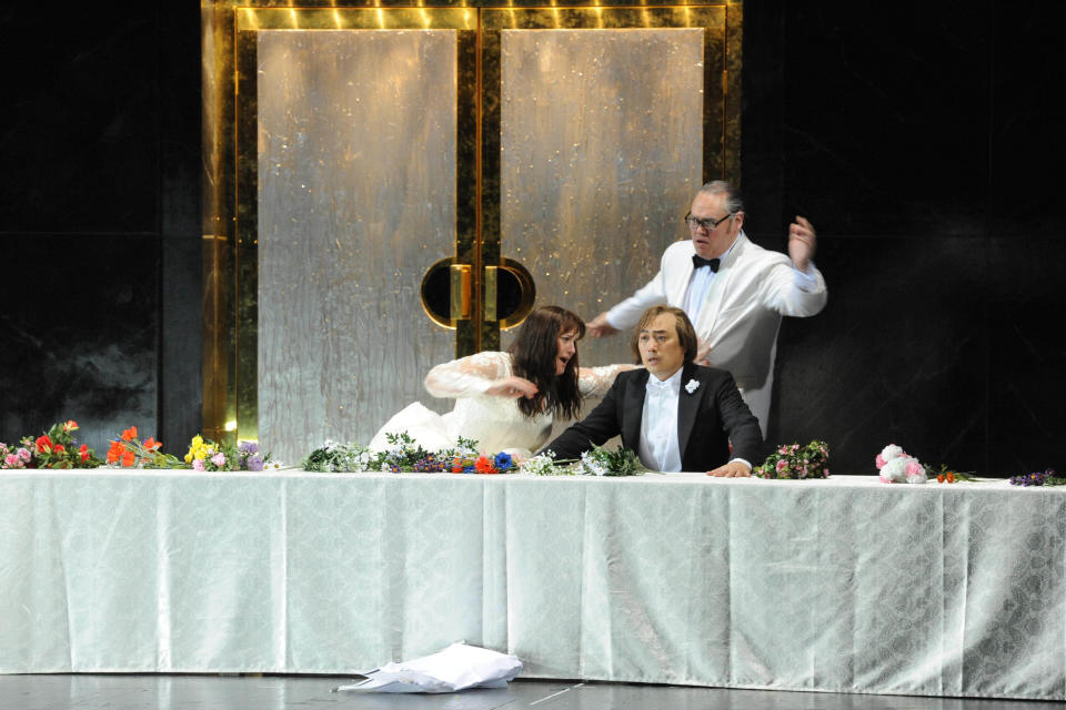 In this June 10 2013 picture, provided by the Frankfurt Opera House, from left: Elza van den Heever as Duchess Helene, Alfred Kim as Henri, a young Sicilian and Quinn Kelsey as Guy de Montfort perform in Frankfurt during a dress rehearsal for the rarely heard original French version of the Opera 'Les vepres Siciliennes' (The Sicilian vespers) by Giuseppe Verdi which had its premiere on June 16, 2013 at the Opera in Frankfurt, Germany. (AP Photo/Thilo Beu, Oper Frankfurt) MANDATORY CREDIT