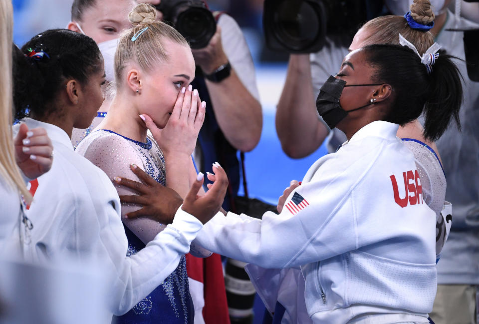 -TOKYO,JAPAN July 26, 2021: USAs Simone Biles and ROCs Angelina Melnikova embrace after the womens team final at the 2020 Tokyo Olympics.  (Wally Skalij /Los Angeles Times via Getty Images)