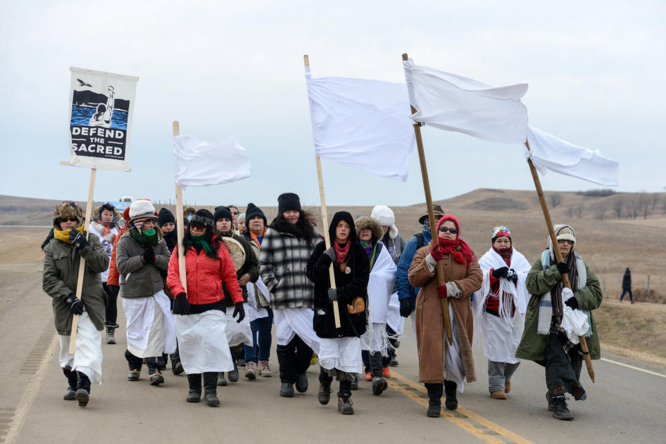 Women march to Backwater Bridge during a protest against plans to pass the Dakota Access pipeline near the Standing Rock Indian Reservation, near Cannon Ball, North Dakota, U.S. November 27, 2016. REUTERS/Stephanie Keith