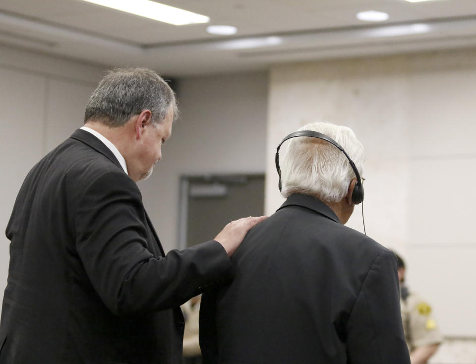 Attorney Harold Mesick, left, reacts alongside Ruben Flores as the jury reads the verdict during Ruben Flores' trial in Monterey County Superior Court on Tuesday, Oct. 18, 2022, in Salinas, Calif. The jury acquitted Flores of helping his son, Paul Flores, cover up the murder of Cal Poly student Kristin Smart. (Laura Dickinson/The Tribune via AP, Pool)