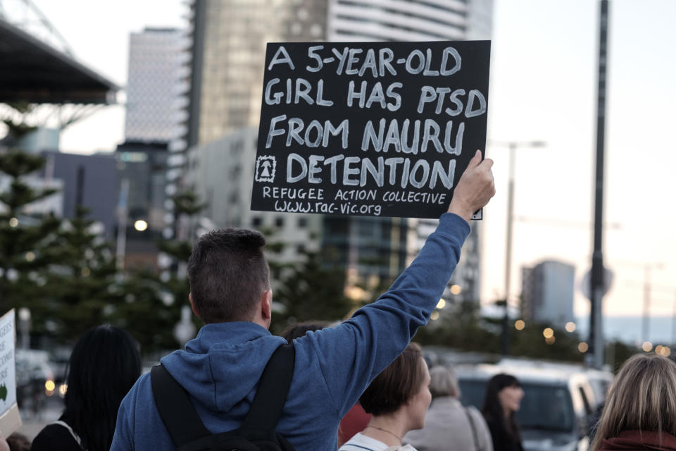 MELBOURNE, AUSTRALIA - APRIL 08:  Protestors rally outside a venue as they wait for Australian Prime Minister Malcolm  Turnbull to arrive on April 8, 2016 in Melbourne, Australia. Protesters from the Refugee Action Collective are demanding the closure of detention centres on Nauru and Manus Island as well as continuing their campaign for the 267 asylum seekers at risk of being sent offshore. The Liberal Party is hosting the dinner to celebrate the 20-year anniversary of the Howard Government's election.  (Photo by Luis Ascui/Getty Images)