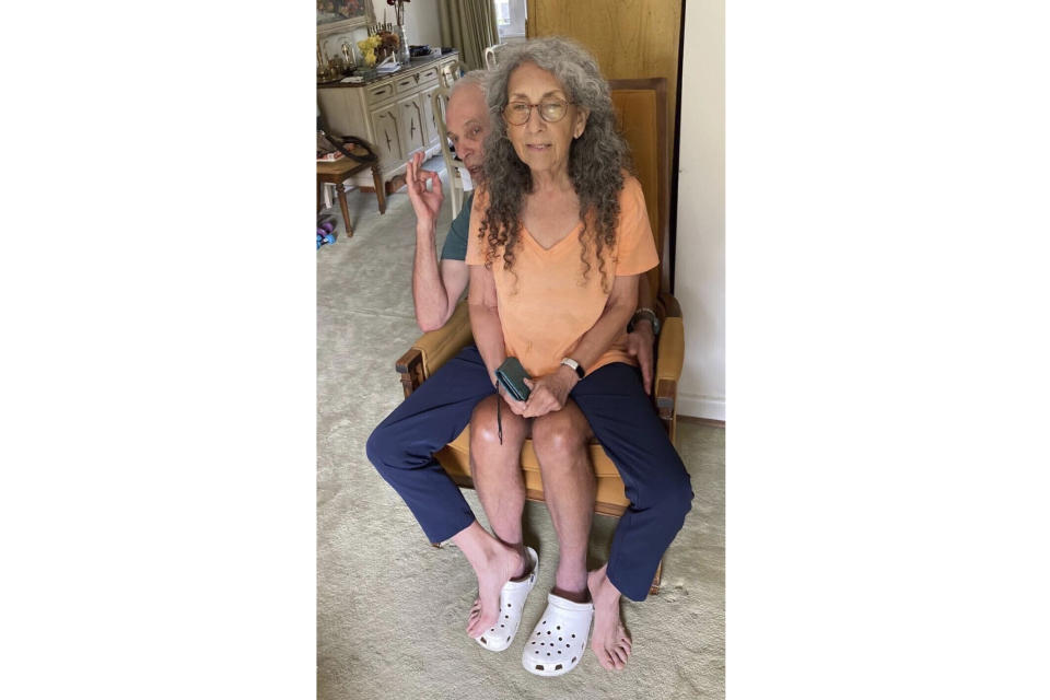 In this undated, unknown location photo released by Iris Weinstein Haggai, Judih Weinstein sits with Gad Haggai as they pose for a photo. (Iris Weinstein Haggai via AP)