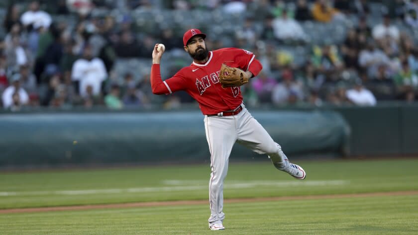 Los Angeles Angels third baseman Anthony Rendon (6) throws to first on a sacrifice bunt.