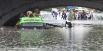 NEW DELHI, INDIA JULY 19: A man is rescued after his vehicle was submerged following heavy rain and waterlogging under the Minto Bridge, on July 19, 2020 in New Delhi, India. Moderate-to-heavy rain lashed several states in northern, eastern and coastal India on Sunday, but the monsoon activity continued to remain subdued in Delhi, which has recorded a 40 per cent rainfall deficiency despite an early onset of the seasonal weather system. (Photo By Arvind Yadav/Hindustan Times via Getty Images)