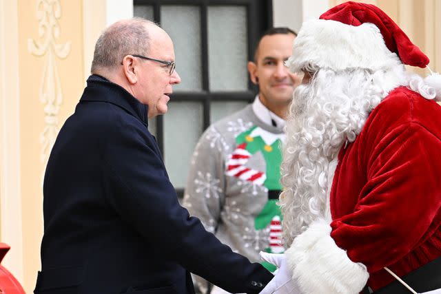 <p>Stephane Cardinale/PLS Pool/Getty</p> Prince Albert greets Santa Claus at the Monaco Palace on Dec. 20.