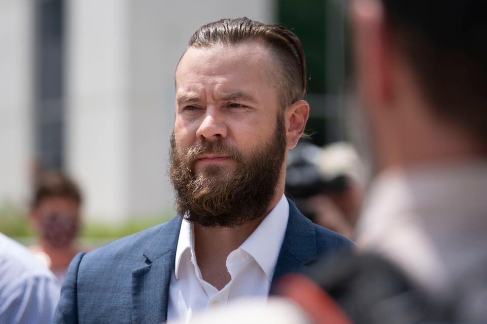 Cade Cothren, former aide to former Tennessee House Speaker Glen Casada, walks out of the Fred D Thompson Federal Building & Courthouse after pleading not guilty to federal charges ranging from money laundering to bribery Tuesday, Aug. 23, 2022 in Nashville, Tenn .  