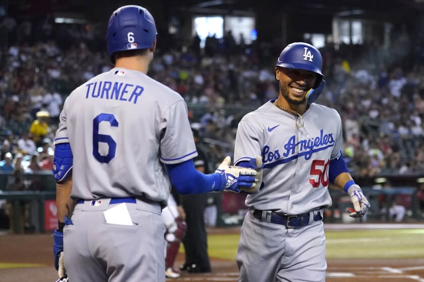 Los Angeles Dodgers' Mookie Betts (50) celebrates his solo home run against the Arizona Diamondbacks.