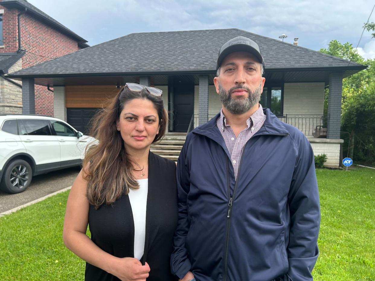 Fadi and Reem Elyoussef have had flooding problems since they moved into their Whitley Avenue home 12 years ago. 'In our house, the F-word is flood,' Reem says. (Mike Smee/CBC - image credit)