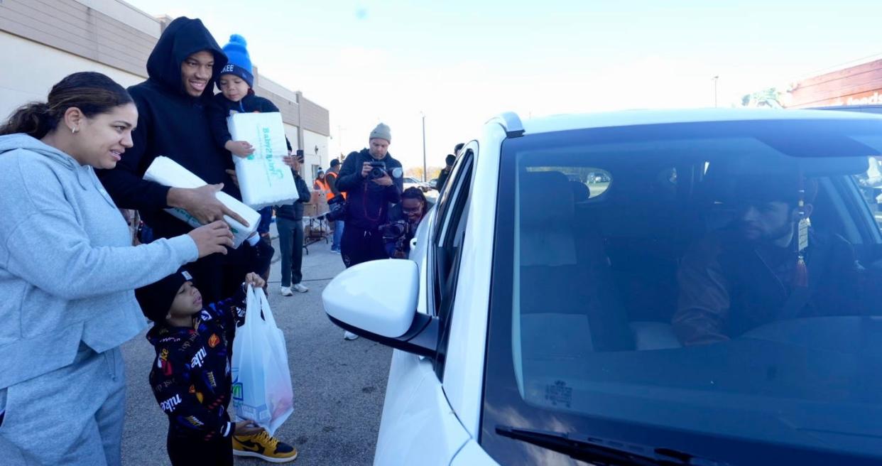 Giannis Antetokounmpo, Mariah Riddlesprigger, Liam Antetokounmpo, Maverick Antetokounmpo and members of the Milwaukee Diaper Mission handed out diapers to those in need on Sunday at Hayat Pharmacy in Milwaukee.