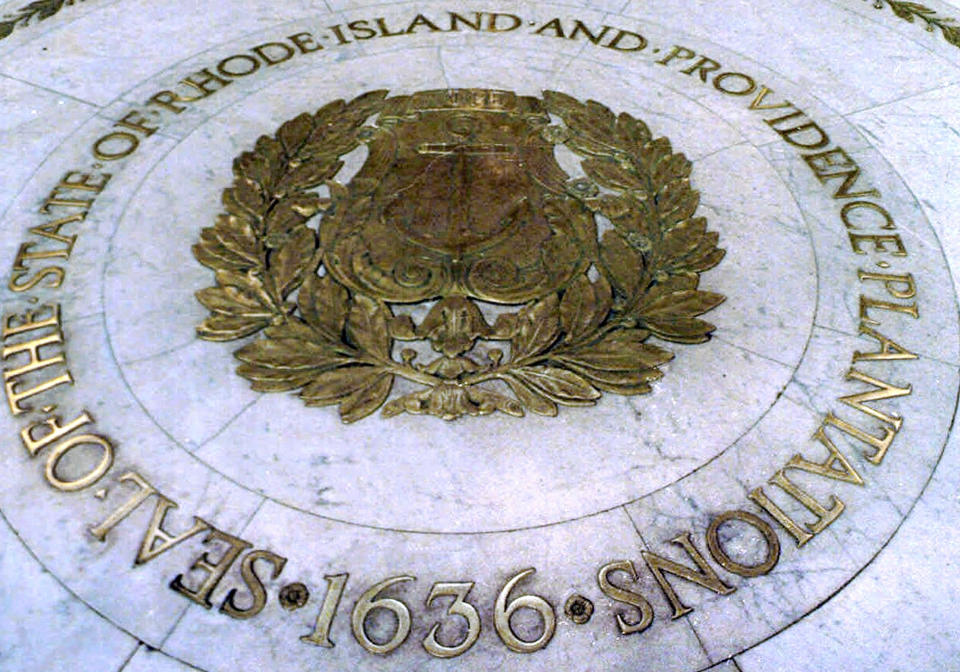 FILE - This Jan. 21, 2000, file photo shows the seal bearing the official name "State of Rhode Island and Providence Plantations" on the floor of the Statehouse rotunda in Providence, R.I. A statewide ballot question in the Nov. 3, 2020, election asks voters whether to shorten the state's official name to drop the plantations reference. (AP Photo/Susan E. Bouchard, File)