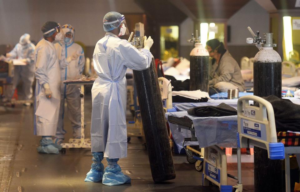 Doctors in New Delhi, India, on May 17 tend to patients. Source: Getty