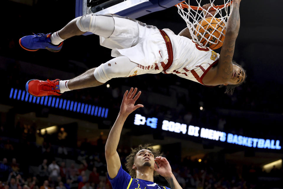 Iowa State's Keshon Gilbert dunks as South Dakota State's Zeke Mayo watches during the first half of a first-round college basketball game in the NCAA Tournament Thursday, March 21, 2024, in Omaha, Neb. (AP Photo/John Peterson)