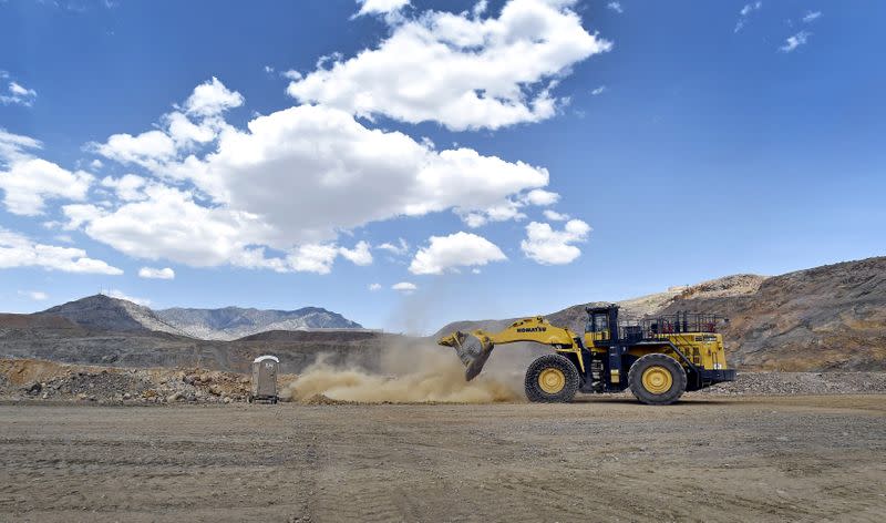 FILE PHOTO: A front-end loader is used to reinforce a safety berm inside the open pit at a rare earth facility in California