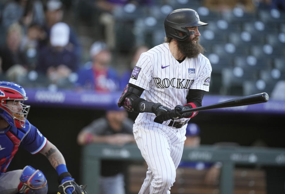 Colorado Rockies' Charlie Blackmon breaks from the batter's box after singling off Texas Rangers starting pitcher Jordan Lyles during the second inning of a baseball game Wednesday, June 2, 2021, in Denver. (AP Photo/David Zalubowski)