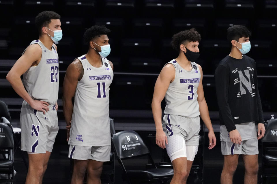 Northwestern players watch during the second half of the team's NCAA college basketball game against Pittsburgh in Evanston, Ill., Wednesday, Dec. 9, 2020. Pittsburgh won 71-70. (AP Photo/Nam Y. Huh)