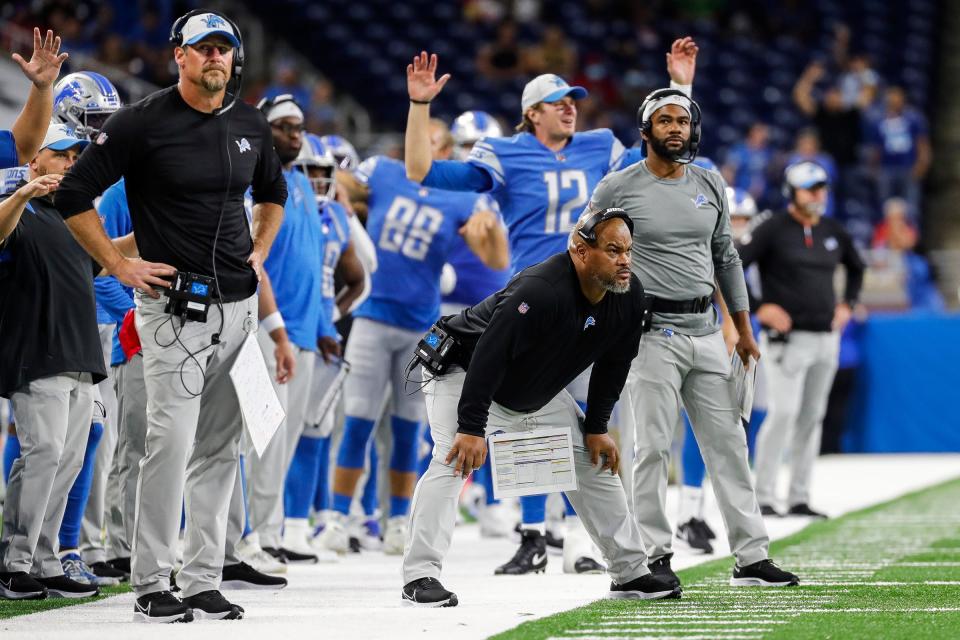 Detroit Lions head coach Dan Campbell and assistant Duce Staley watch action against the Buffalo Bills during the second half of the preseason game at Ford Field in Detroit on Friday, Aug. 13, 2021.
