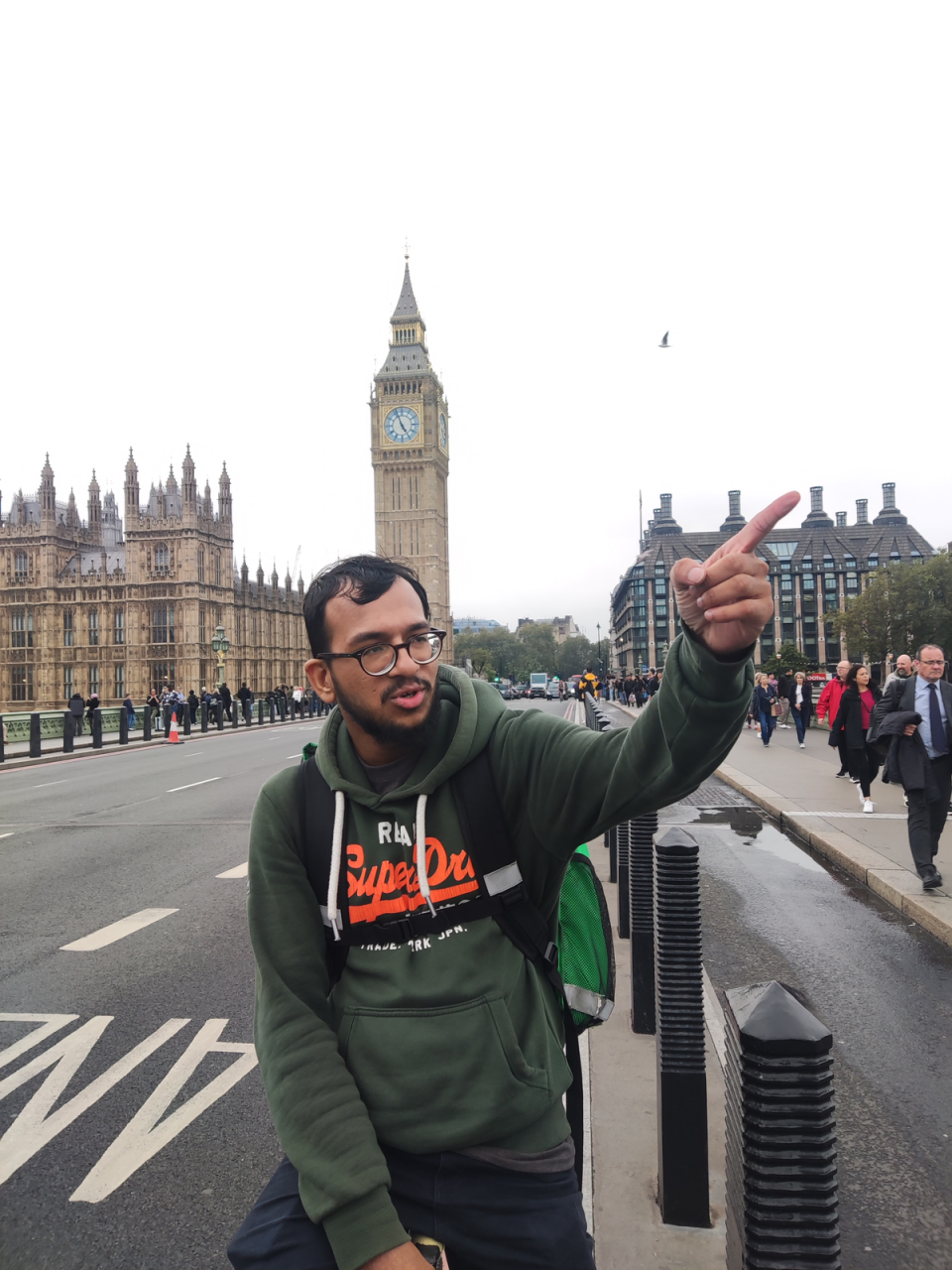 Courier Shaf Hussain enjoying the sights on Westminster Bridge (Barney Davis)